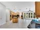 Spacious kitchen with wood cabinetry, granite countertops, an island, and tile flooring at 4641 John Moore Rd, Brandon, FL 33511