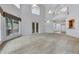 Bright, open living room featuring high ceilings, lots of natural light, and neutral carpet at 4641 John Moore Rd, Brandon, FL 33511