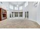 Spacious living room features custom built ins and several windows overlooking the backyard at 4641 John Moore Rd, Brandon, FL 33511