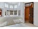 Bright living room features an elevator and multiple windows for natural light at 4641 John Moore Rd, Brandon, FL 33511