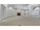 Bright living room features a fireplace, carpeted floors, and access to the front entrance at 4641 John Moore Rd, Brandon, FL 33511