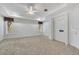 Spacious main bedroom with neutral carpet and a secure safe room for peace of mind at 4641 John Moore Rd, Brandon, FL 33511