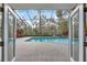 Outdoor pool features a gorgeous view, screened-in porch, and brick paved patio at 4641 John Moore Rd, Brandon, FL 33511