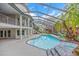Rear view of house from pool area with balcony and stairs at 4641 John Moore Rd, Brandon, FL 33511