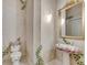 Charming powder room features custom paint, vanity sink, toilet, and an ornate gold mirror at 4641 John Moore Rd, Brandon, FL 33511