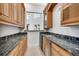 Wet bar with wooden cabinets, granite countertops, and stainless steel beverage cooler at 4641 John Moore Rd, Brandon, FL 33511
