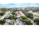 An aerial view showcasing the property's location with nearby buildings and ocean view at 4726 W Fairview Hts, Tampa, FL 33616