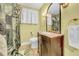 Bathroom featuring a vanity with marble countertop, and a shower with nature-themed curtains at 4726 W Fairview Hts, Tampa, FL 33616