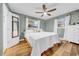 Bright bedroom with a ceiling fan and two windows for natural light at 4726 W Fairview Hts, Tampa, FL 33616