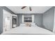 Grey bedroom with a full size bed, mirror, and ensuite bathroom at 4726 W Fairview Hts, Tampa, FL 33616