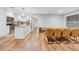Open dining area with modern wood floors adjacent to the kitchen at 4726 W Fairview Hts, Tampa, FL 33616