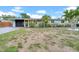 Charming single-story home with a well-manicured lawn and mature landscaping, offering great curb appeal at 4726 W Fairview Hts, Tampa, FL 33616