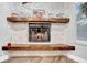 Close up of fireplace featuring a stacked stone hearth and wooden mantel at 4726 W Fairview Hts, Tampa, FL 33616