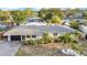 Aerial view of a home with a well-maintained front yard and lush landscaping at 4726 W Fairview Hts, Tampa, FL 33616