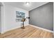 Bright room with a built in bar, gray accent wall and hardwood floors at 4726 W Fairview Hts, Tampa, FL 33616