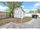 Backyard featuring a shed, a gas grill, and concrete patio at 4726 W Fairview Hts, Tampa, FL 33616