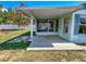 This cozy backyard offers a covered porch that complements the light blue facade of the home at 502 Chilt Dr, Brandon, FL 33510