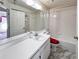 Bright bathroom features a well-maintained shower/tub combo and a classic vanity area at 502 Chilt Dr, Brandon, FL 33510