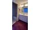 Bathroom with white vanity, floral wallpaper, and shower/tub combo at 502 Chilt Dr, Brandon, FL 33510