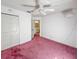 Bedroom featuring pink carpet, closet, and an attached bathroom at 502 Chilt Dr, Brandon, FL 33510