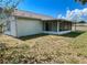 Exterior showcasing a screened-in patio enhances the home's connection to the outdoor space at 502 Chilt Dr, Brandon, FL 33510