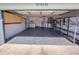 Organized garage with storage cabinets, shelving, laundry area featuring a washer, dryer, and water heater at 502 Chilt Dr, Brandon, FL 33510