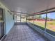 Screened-in lanai with tile flooring and an open view of the backyard at 502 Chilt Dr, Brandon, FL 33510