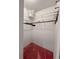 Walk-in closet with white walls, red carpet, and wire shelving at 502 Chilt Dr, Brandon, FL 33510
