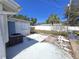 Backyard features an AC unit, patio, and partial fence line at 5031 Billings Dr, Holiday, FL 34690