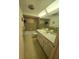 Retro bathroom with tiled floors, bathtub, and built-in vanity at 5031 Billings Dr, Holiday, FL 34690