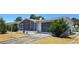 Charming home featuring a screened porch, attached garage and low maintenance rock landscaping at 5031 Billings Dr, Holiday, FL 34690