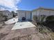 Home exterior with brick and tile patio, and blue door at 5031 Billings Dr, Holiday, FL 34690