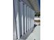 Home featuring white hurricane shutters at 5031 Billings Dr, Holiday, FL 34690