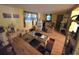 Comfortable living room with hardwood floors, seating, and warm lighting at 5031 Billings Dr, Holiday, FL 34690