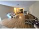Bright living room with hardwood floors, comfortable seating, and natural light at 5031 Billings Dr, Holiday, FL 34690