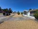 Street view of the charming neighborhood featuring single-Gathering homes with driveways and desert landscaping at 5031 Billings Dr, Holiday, FL 34690