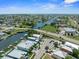 Expansive aerial view showcases waterfront homes, canals, and the surrounding community, offering a glimpse of coastal living at 574 Bimini Bay Blvd, Apollo Beach, FL 33572