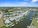High-angle shot of waterfront community with numerous boat docks, offering convenient access to the water from many homes at 574 Bimini Bay Blvd, Apollo Beach, FL 33572