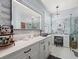 Modern bathroom with dual vanities, marble countertops, and glass shower at 574 Bimini Bay Blvd, Apollo Beach, FL 33572