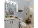 Bright bathroom features white vanity, walk-in glass shower, and wall cabinet at 574 Bimini Bay Blvd, Apollo Beach, FL 33572