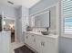 Bathroom featuring marble counters, large mirror, and cabinetry at 574 Bimini Bay Blvd, Apollo Beach, FL 33572