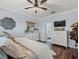Bedroom with dresser, TV, and view to en-suite bathroom at 574 Bimini Bay Blvd, Apollo Beach, FL 33572
