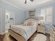 Cozy bedroom with ensuite bathroom and hardwood style floors; lots of natural light at 574 Bimini Bay Blvd, Apollo Beach, FL 33572