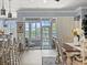 Dining room with table, chairs, and view to patio and pool at 574 Bimini Bay Blvd, Apollo Beach, FL 33572