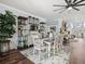 Cozy dining room area featuring stylish shelving and decor with an adjacent living space at 574 Bimini Bay Blvd, Apollo Beach, FL 33572