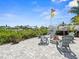 Fire pit with seating area next to the canal and dock at 574 Bimini Bay Blvd, Apollo Beach, FL 33572