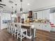 Well-equipped kitchen with stainless steel appliances, a central island, and white cabinetry for a classic look at 574 Bimini Bay Blvd, Apollo Beach, FL 33572
