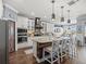 Gourmet kitchen with stainless appliances, marble countertops, and custom cabinetry at 574 Bimini Bay Blvd, Apollo Beach, FL 33572