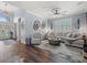 Spacious living room features modern decor, lots of natural light, and vaulted ceiling at 574 Bimini Bay Blvd, Apollo Beach, FL 33572