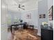 Bright home office with large windows, stylish decor, and hardwood-style floors at 574 Bimini Bay Blvd, Apollo Beach, FL 33572